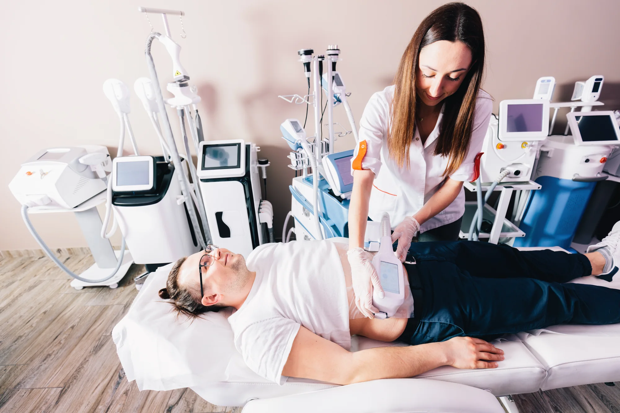Client receiving a treatment with professional aesthetic clinic equipment