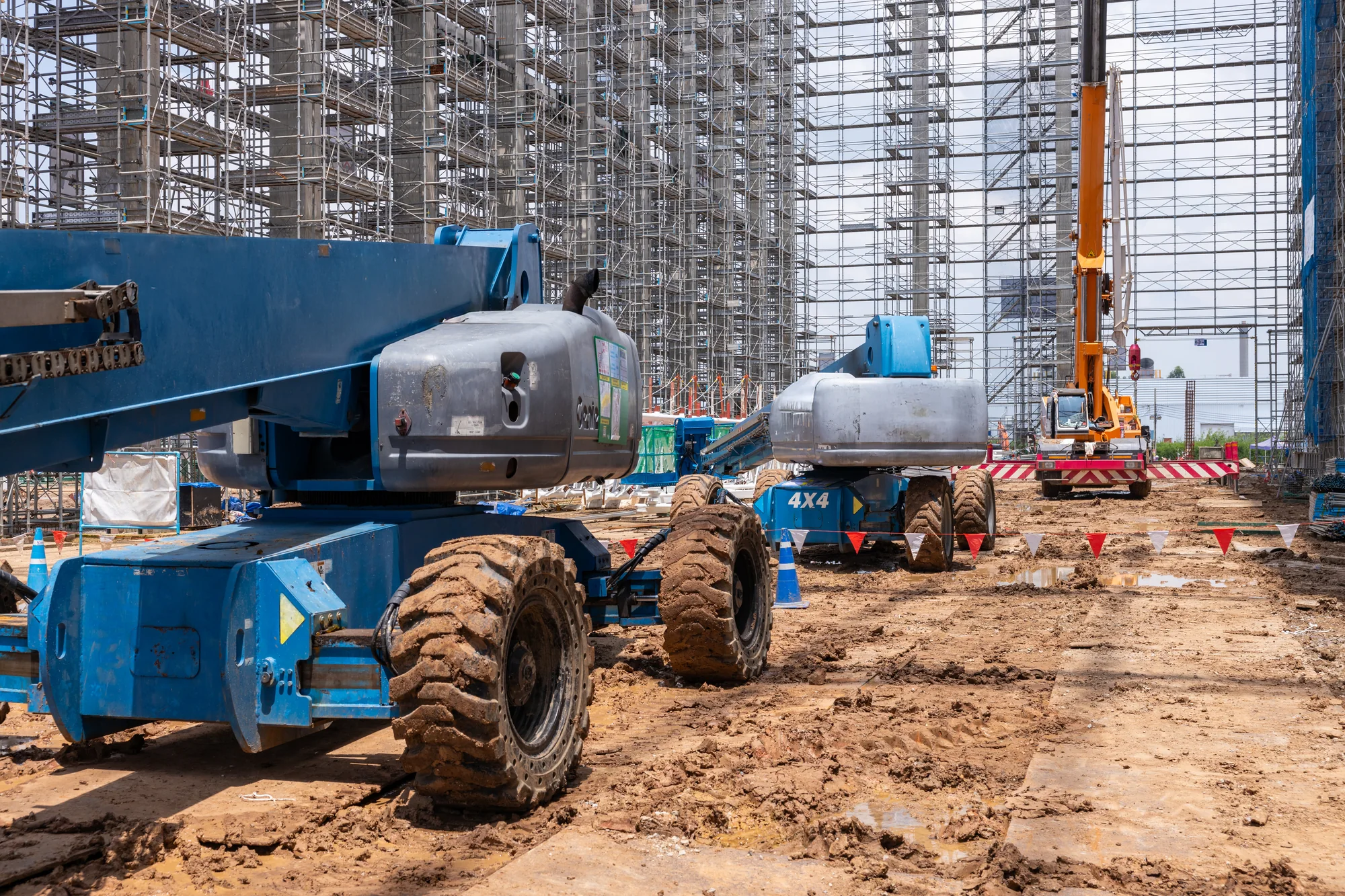 Heavy construction equipment operating at an active commercial job site